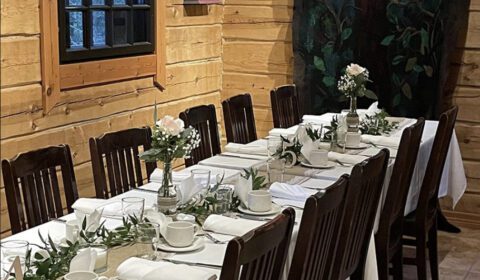 Long dining table setup inside Kivitasku Event Venue Villa for private celebrations