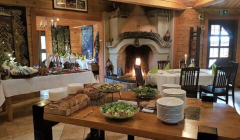 Buffet dining setup at Kivitasku Event Venue Villa with fireplace