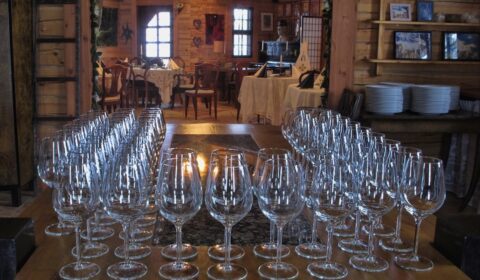 Wine glasses prepared for event dining at Kivitasku Event Venue Villa